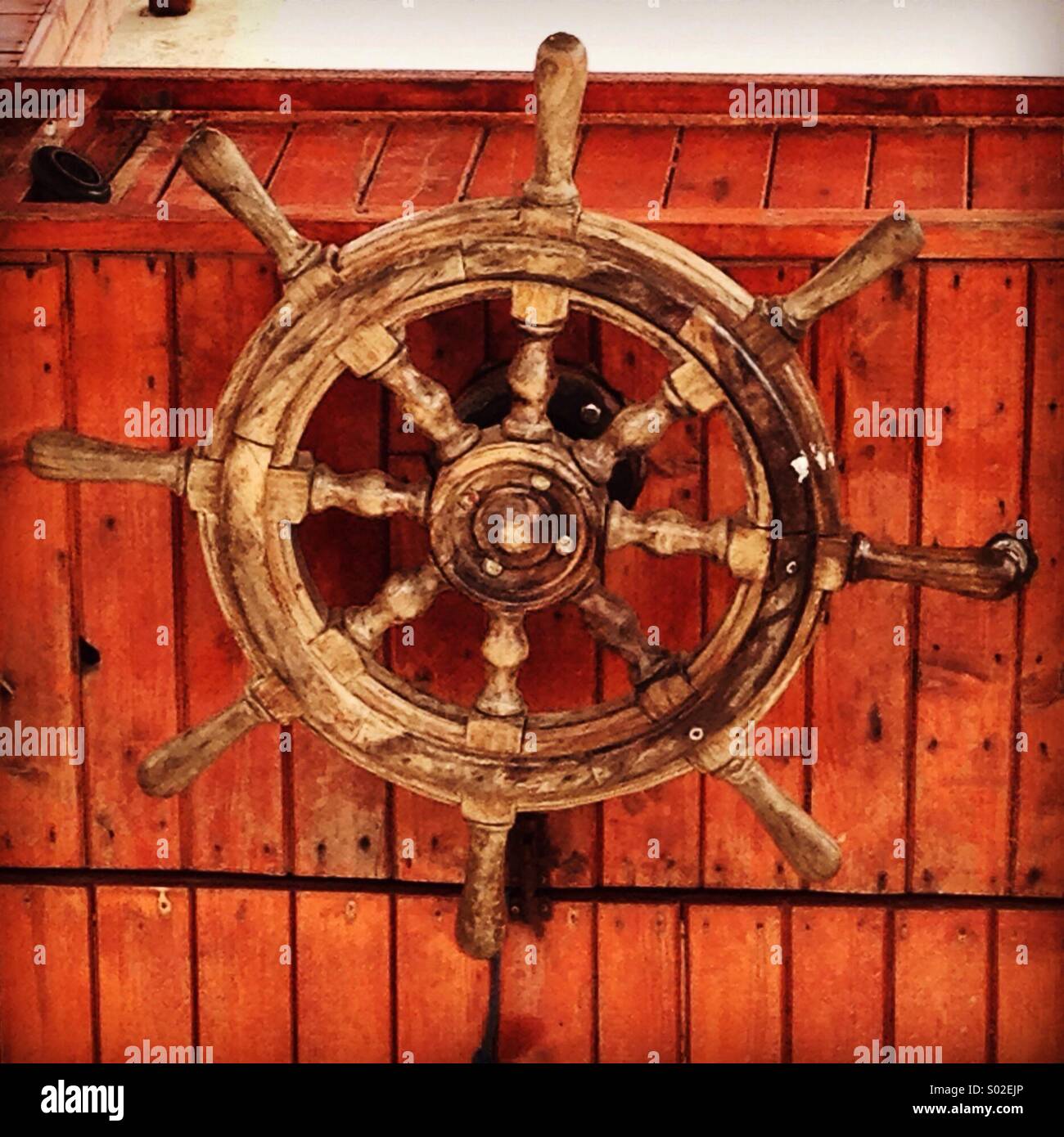 Old captain'a wooden wheel - boat wheel Stock Photo