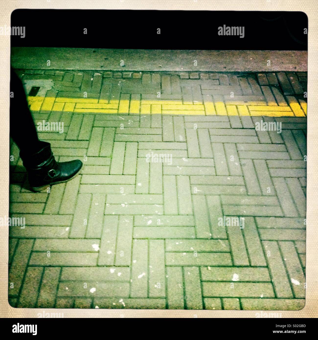 Yellow line gap train mind the gap metro train station waiting woman border limit off limits concept platform - Smartphone Captured Stock Image