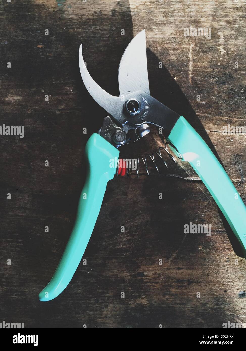 Gardening clippers on farm table. - Smartphone Captured Stock Image