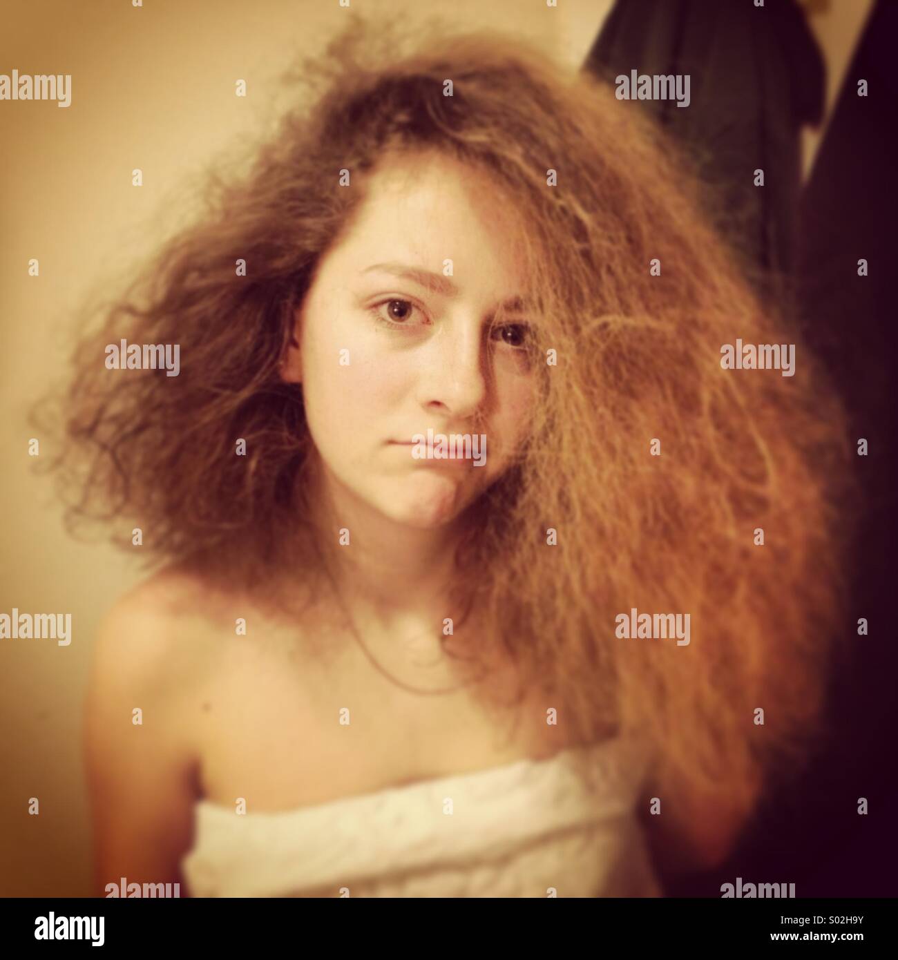 Teenage girl with messy hair Stock Photo