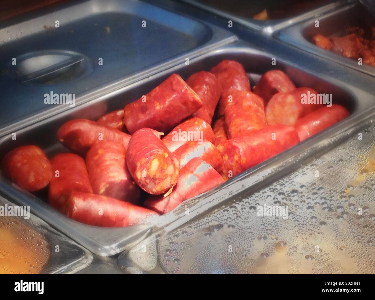 Chorizo sausage in hot table pan - Smartphone Captured Stock Image
