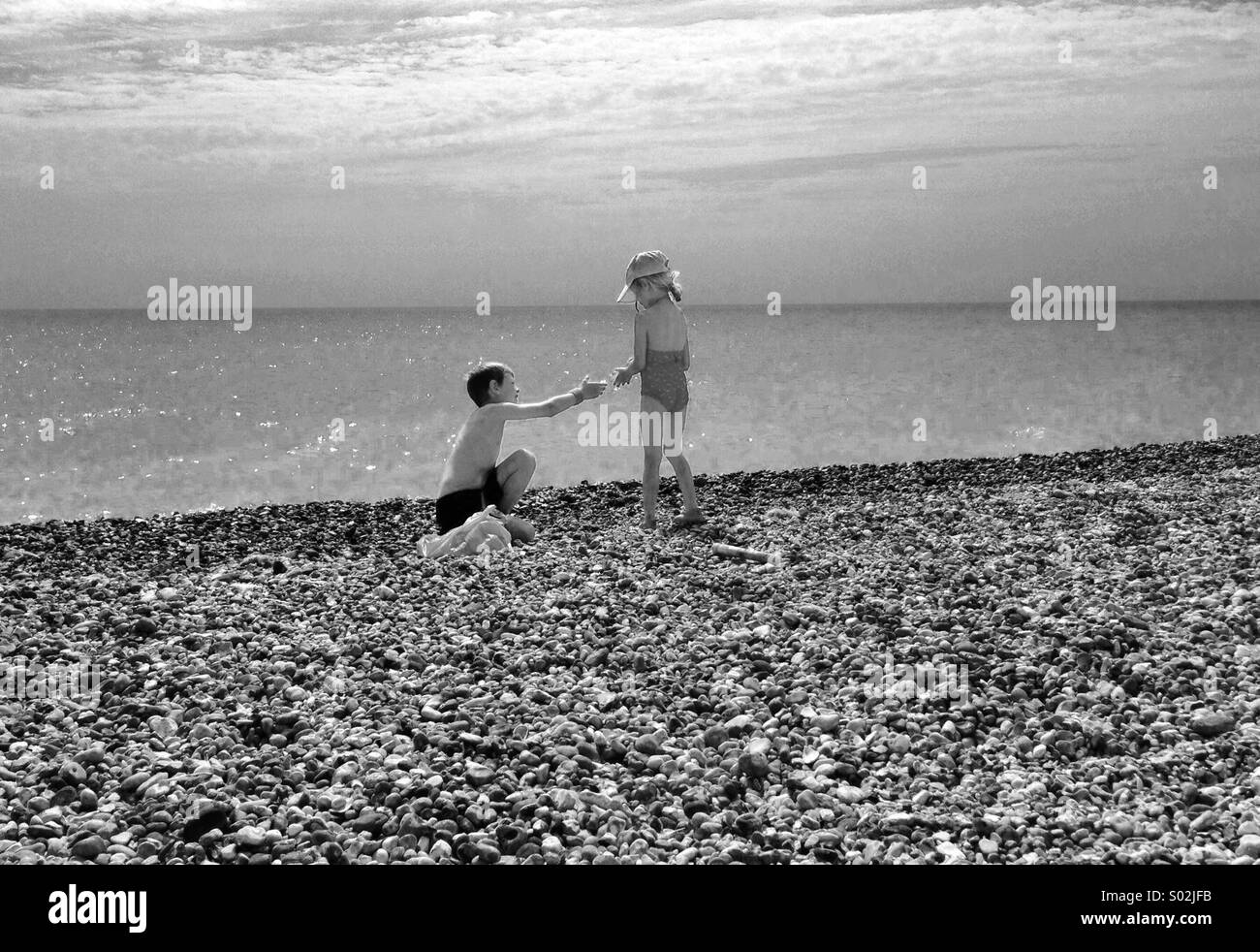 Children playing on the beech Stock Photo
