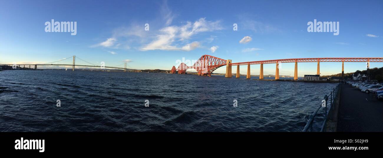 Panoramic view of the Forth Bridges from South Queensferry. Stock Photo