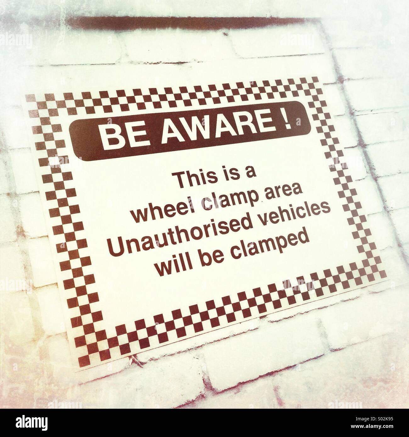 Wheel clamp warning sign Stock Photo