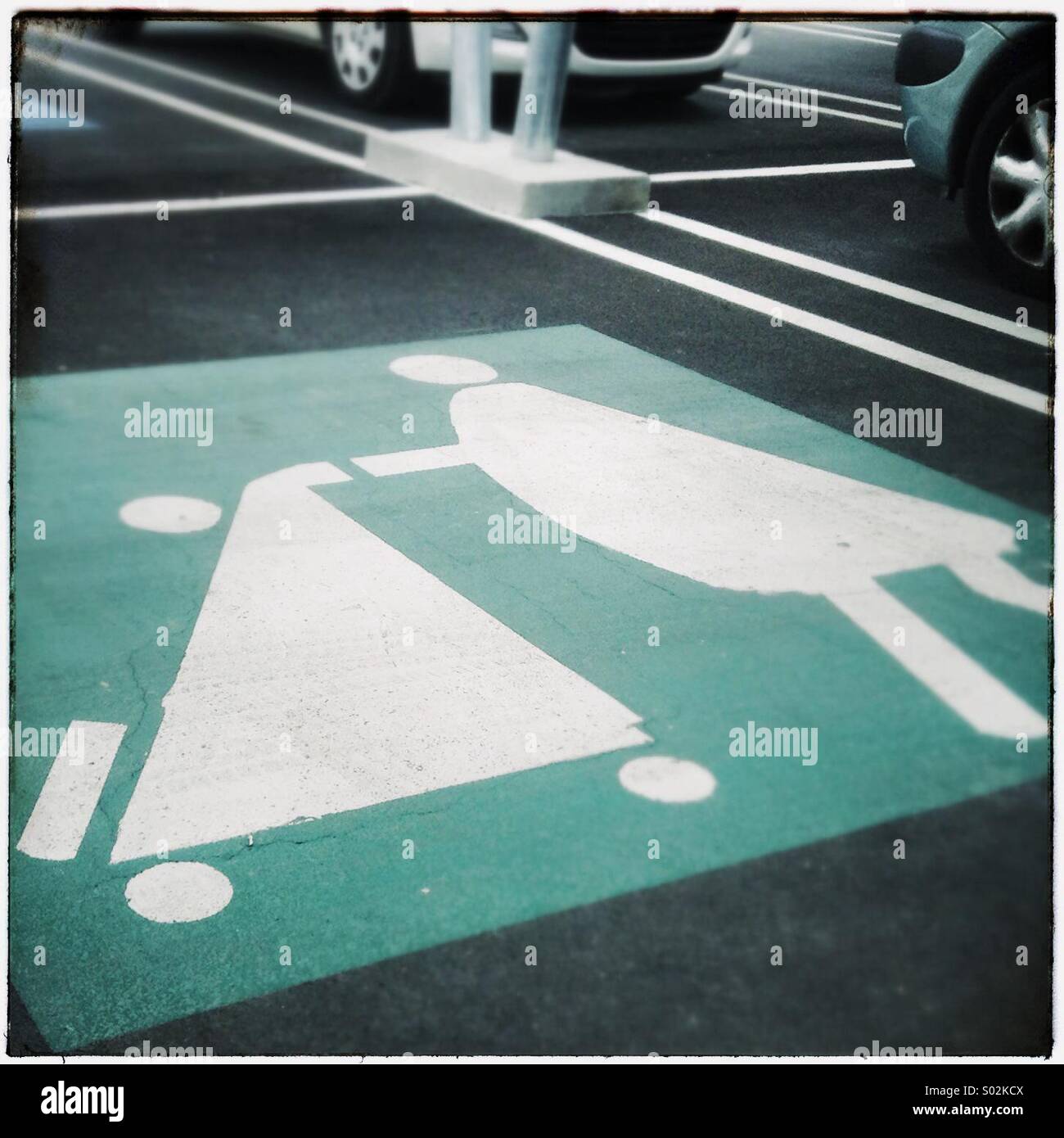 Supermarket parking sign indicating parking bays reserved for families with children - Smartphone Captured Stock Image