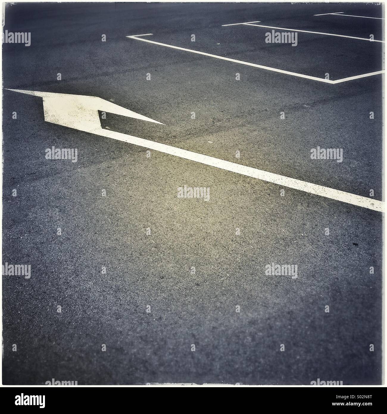 Arrow sign on parking asphalt - Smartphone Captured Stock Image