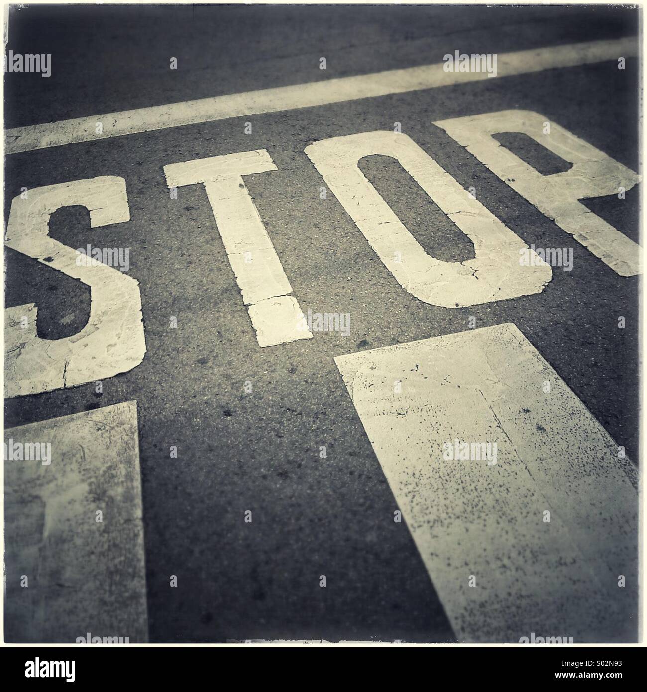 Stop sign on asphalt - Smartphone Captured Stock Image