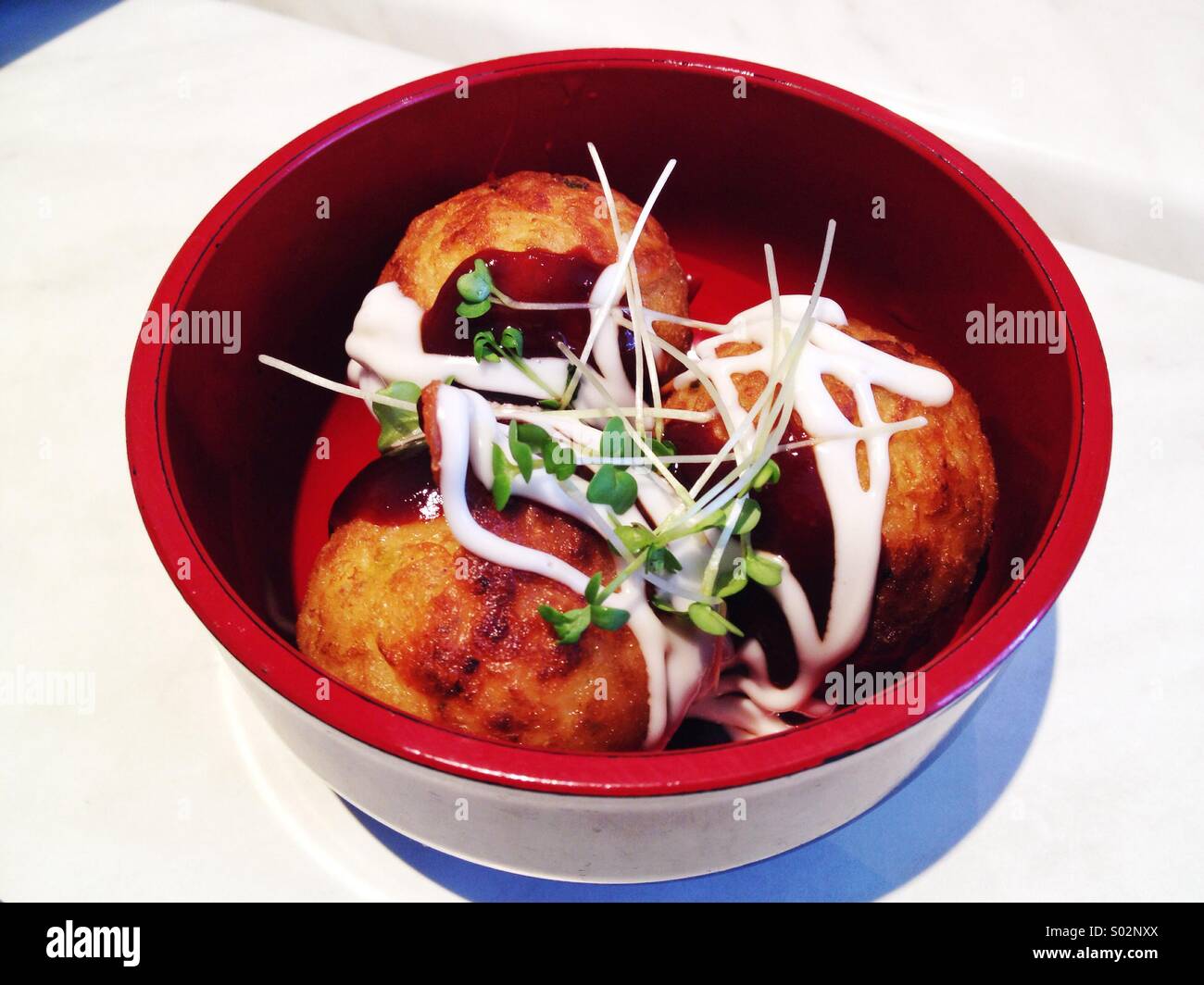 Takoyaki, Japanese octopus balls in soya sauce Stock Photo Alamy