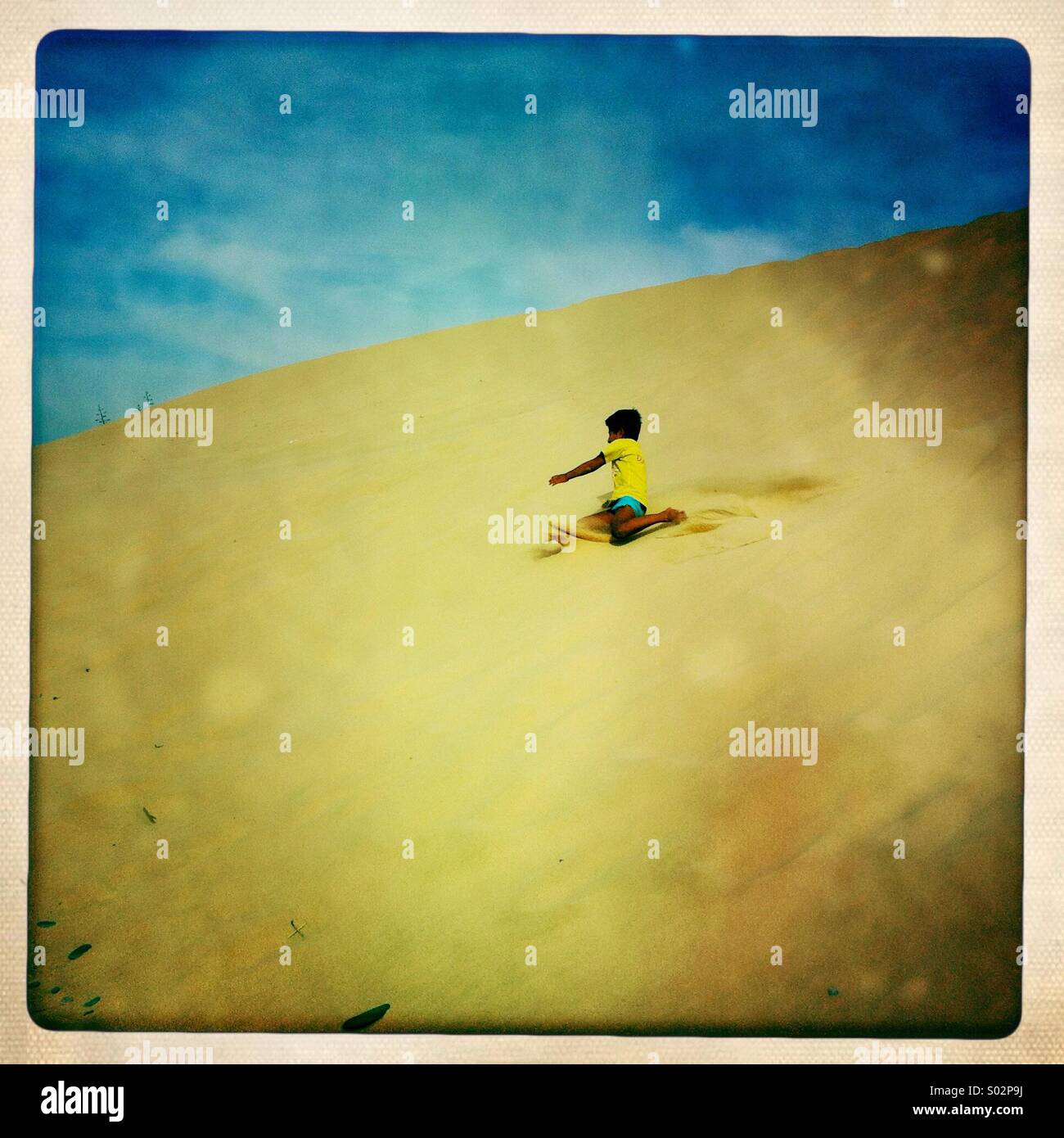 Playing on the sand - Smartphone Captured Stock Image