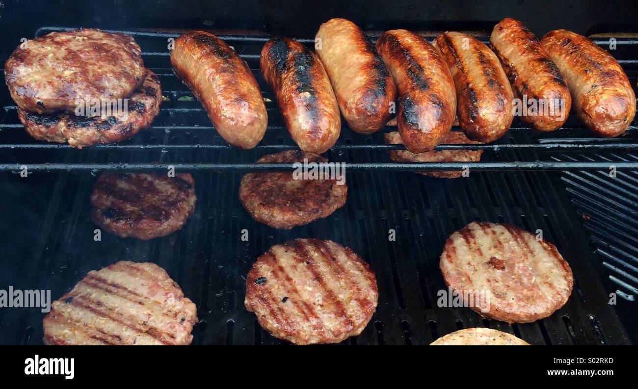 Barbecue grill with sausages and burgers Stock Photo Alamy