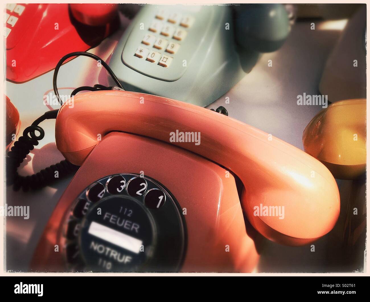 A group of colourful vintage telephones - Smartphone Captured Stock Image
