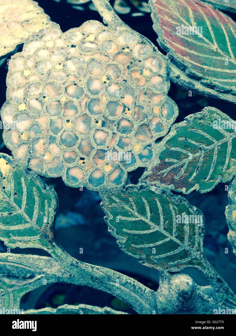 1920's metal garden decoration close up of enamel work - Smartphone Captured Stock Image