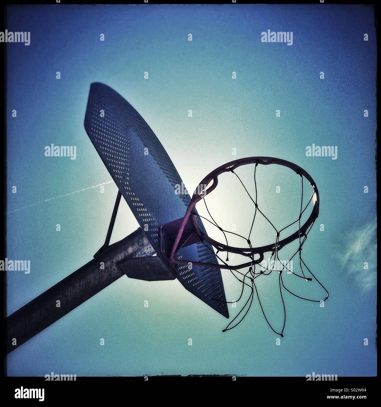 Basketball hoop on a clear blue sky - Smartphone Captured Stock Image