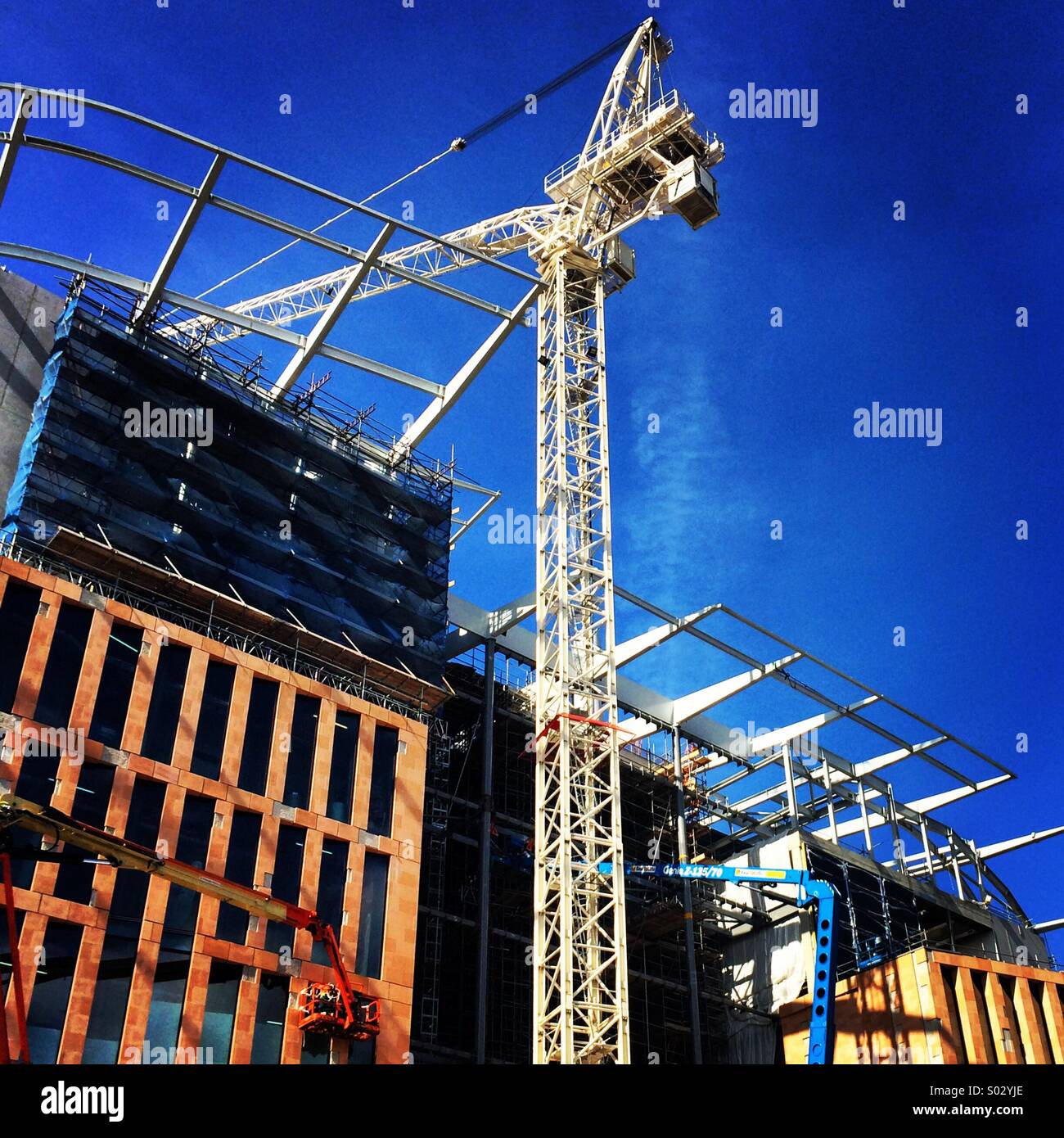 Cranes working on the Francis Crick Institute on St Pancras Road in London. - Smartphone Captured Stock Image
