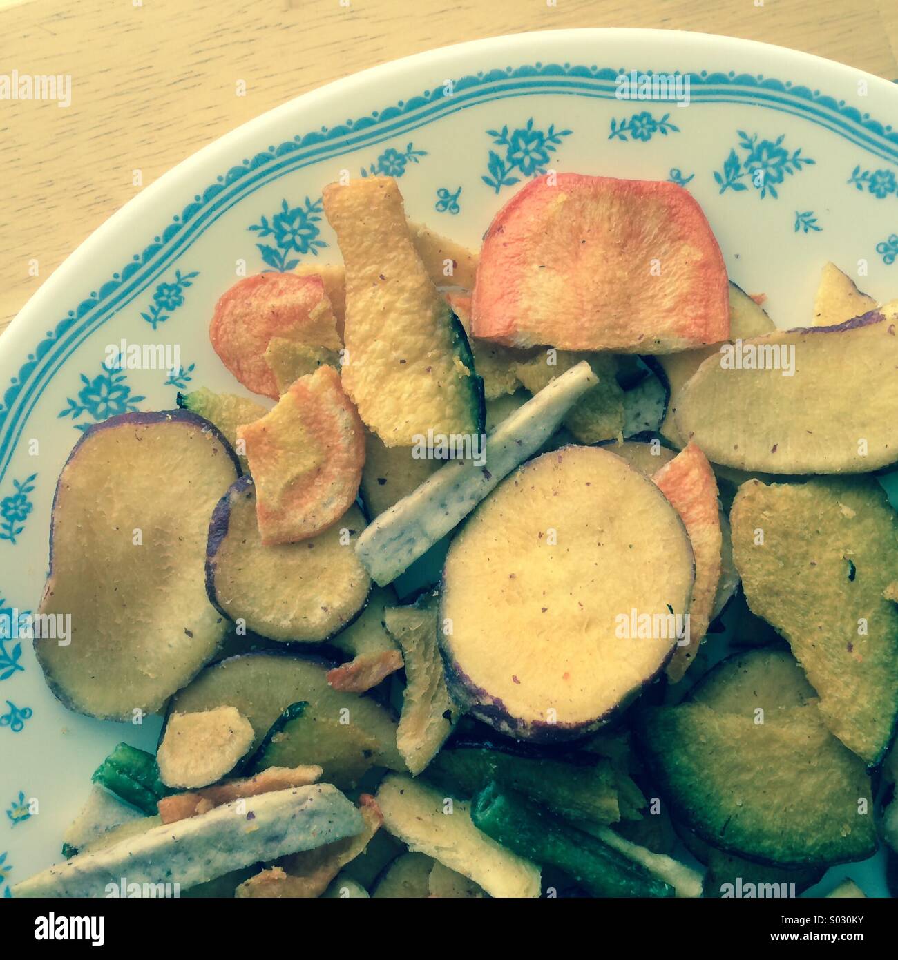 Dried veggie chips on a plate Stock Photo Alamy
