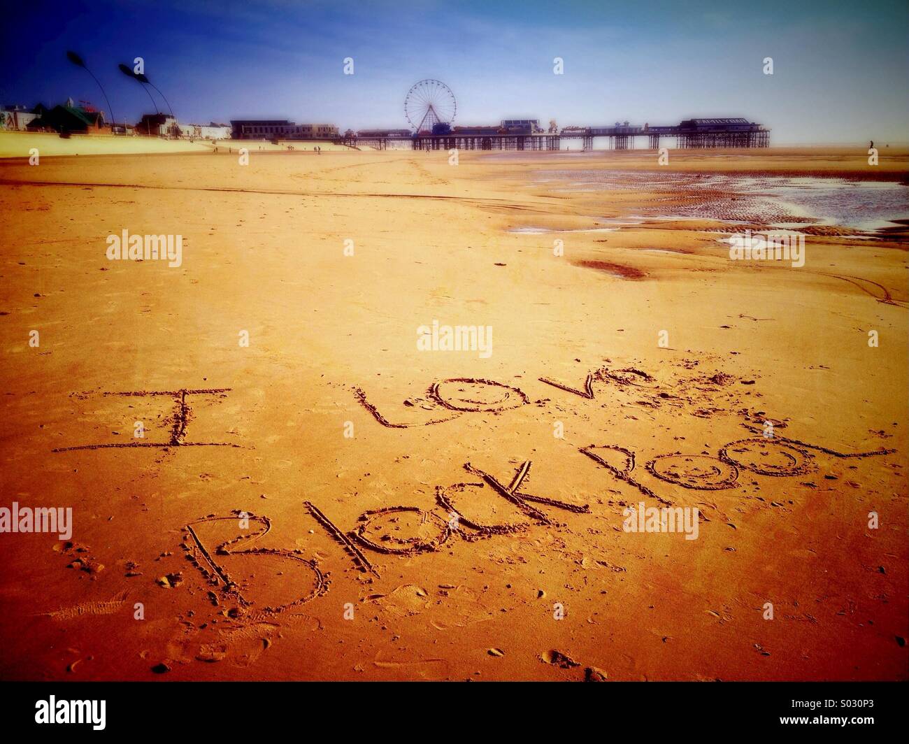 I Love Blackpool written in sand with Central pier in background - Smartphone Captured Stock Image