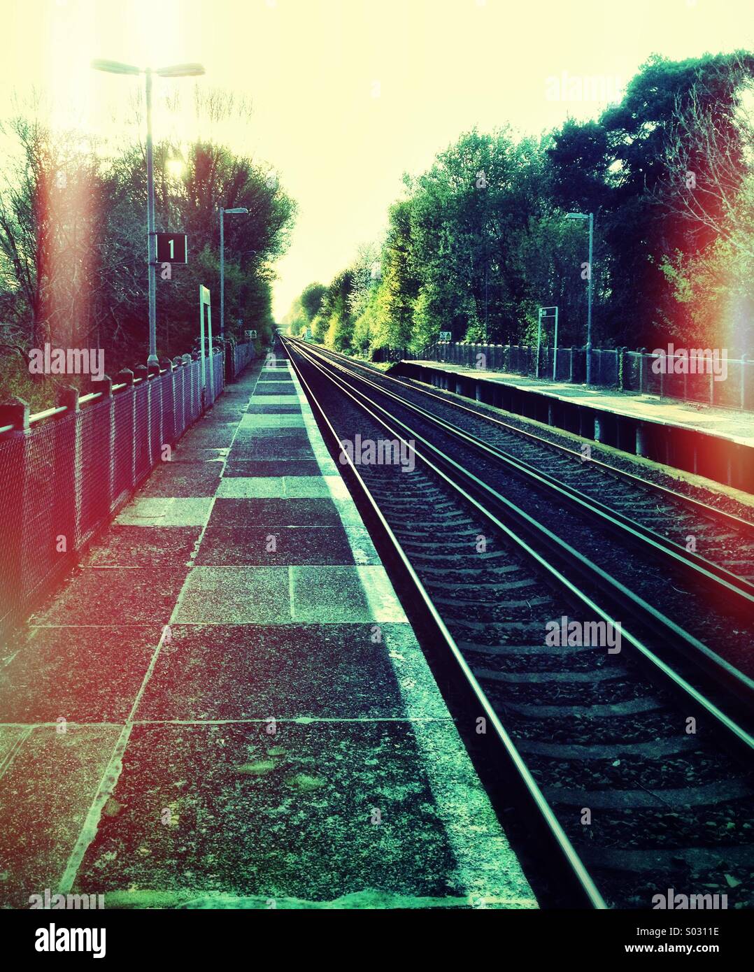 Deserted railway station platform, UK Stock Photo