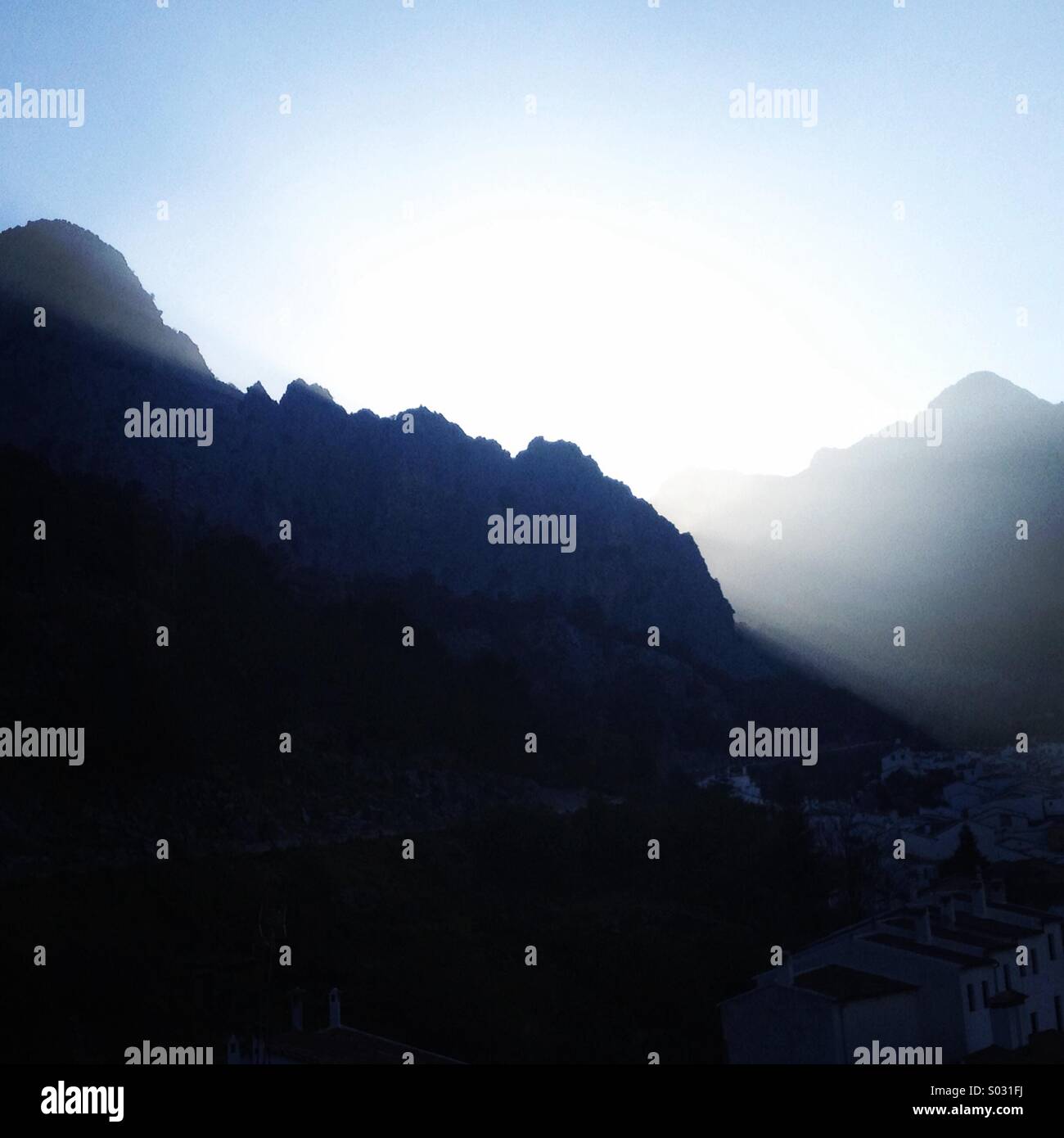 The sun sets over Grazalema, Parque Natural Sierra de Grazalema, Cadiz province, Andalusia, Spain - Smartphone Captured Stock Image