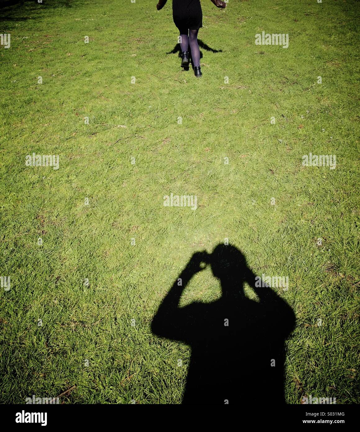Running from shadow Stock Photo Alamy