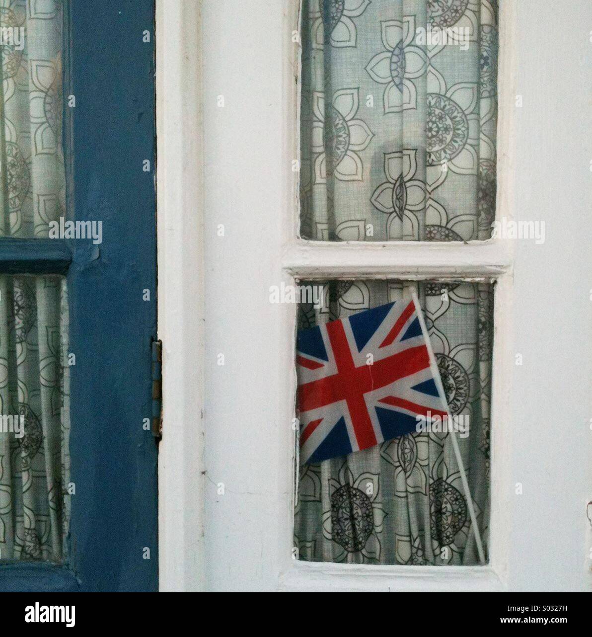 Union Jack in a beach hut window Stock Photo