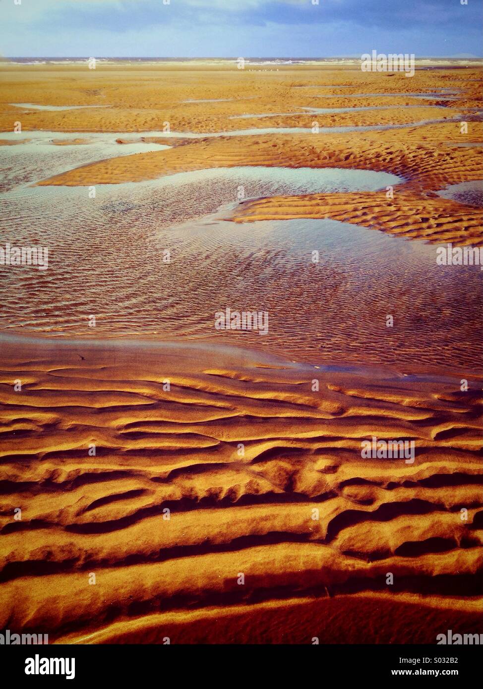 Water pools and ripples in sand at low tide on Blackpool beach Stock ...