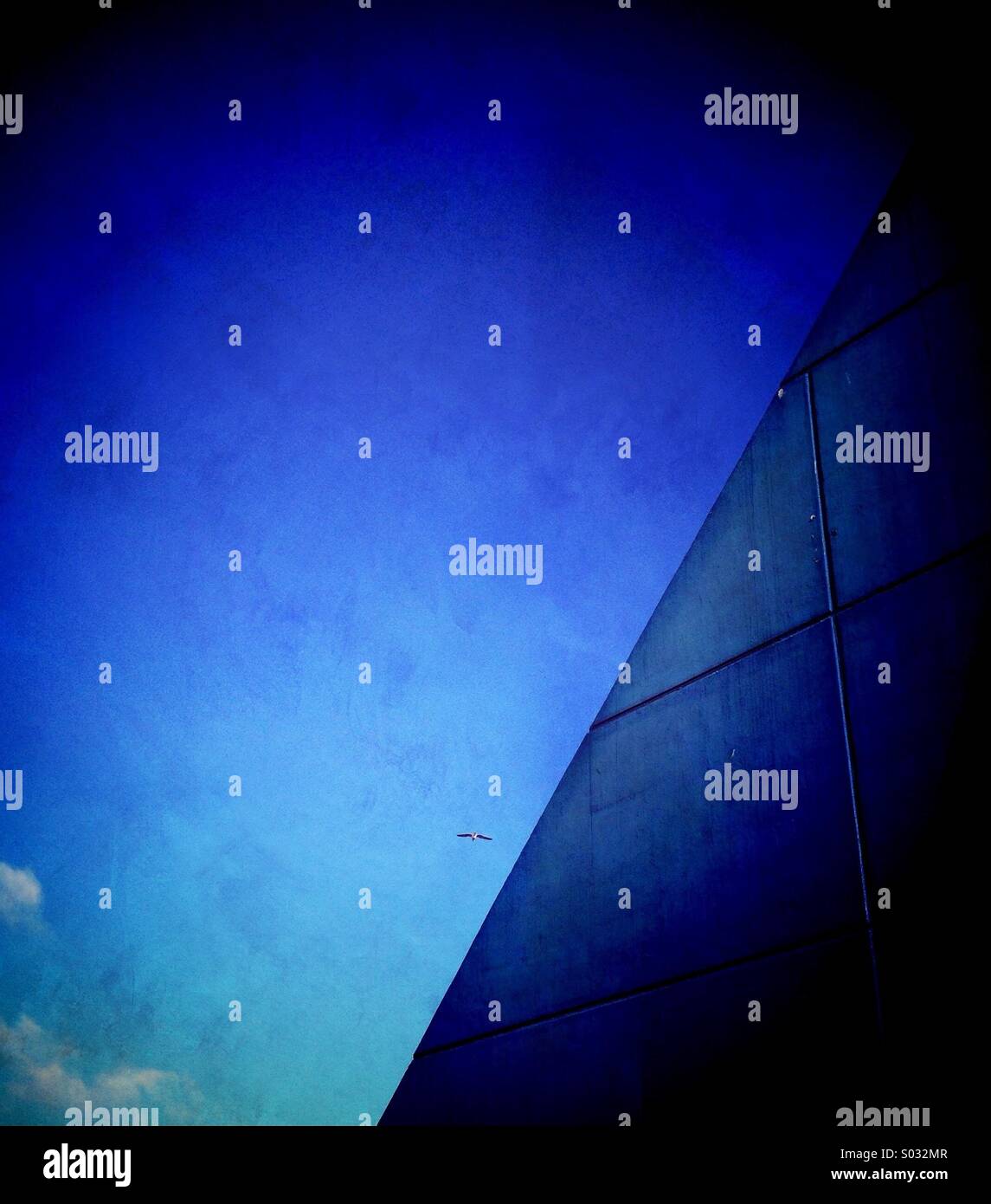 Blue side of Sandcastle complex in Blackpool set against blue sky - Smartphone Captured Stock Image