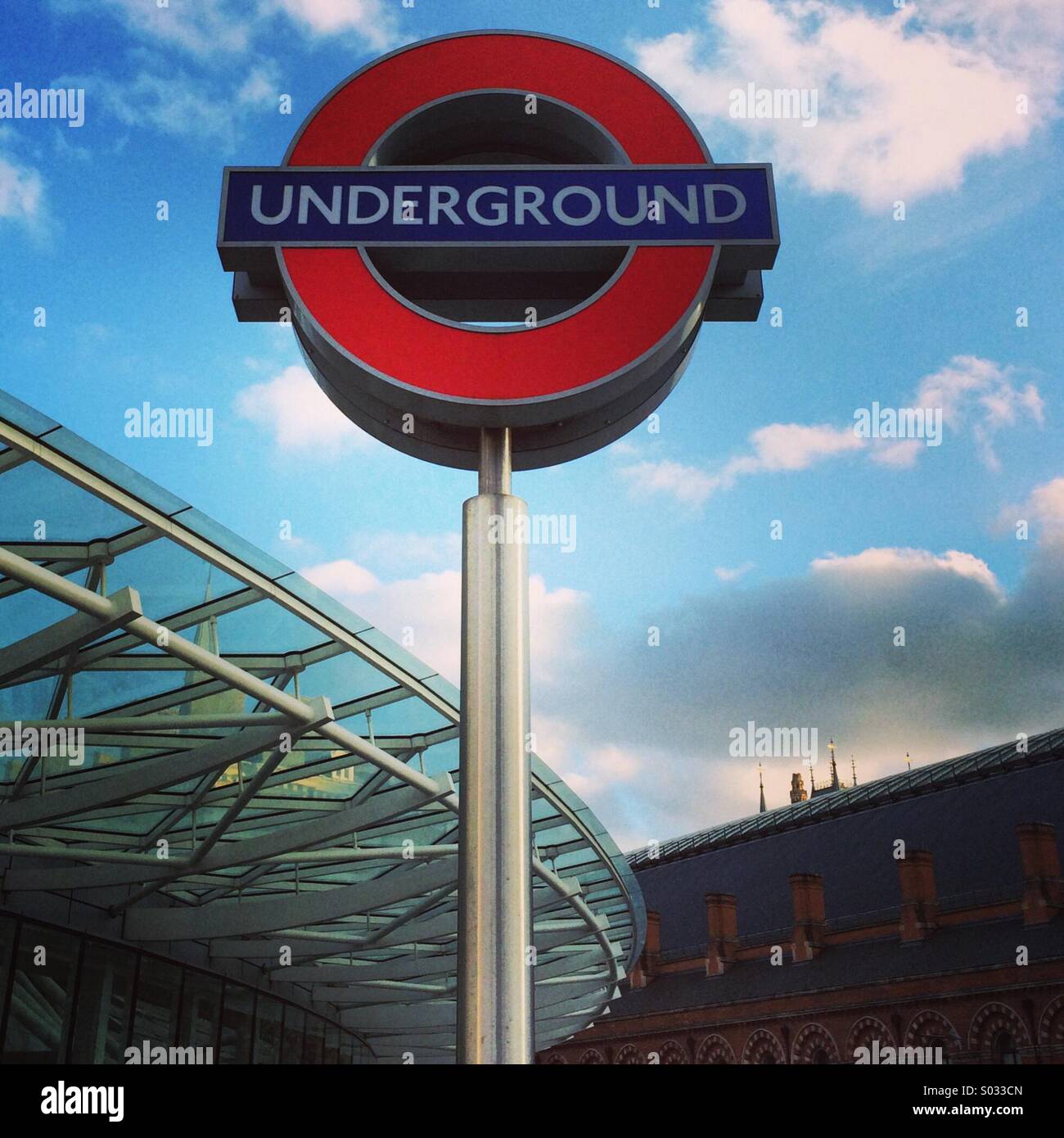 London Underground Tube Roundel Sign outside Kings Cross St Pancras Rail Terminals. - Smartphone Captured Stock Image