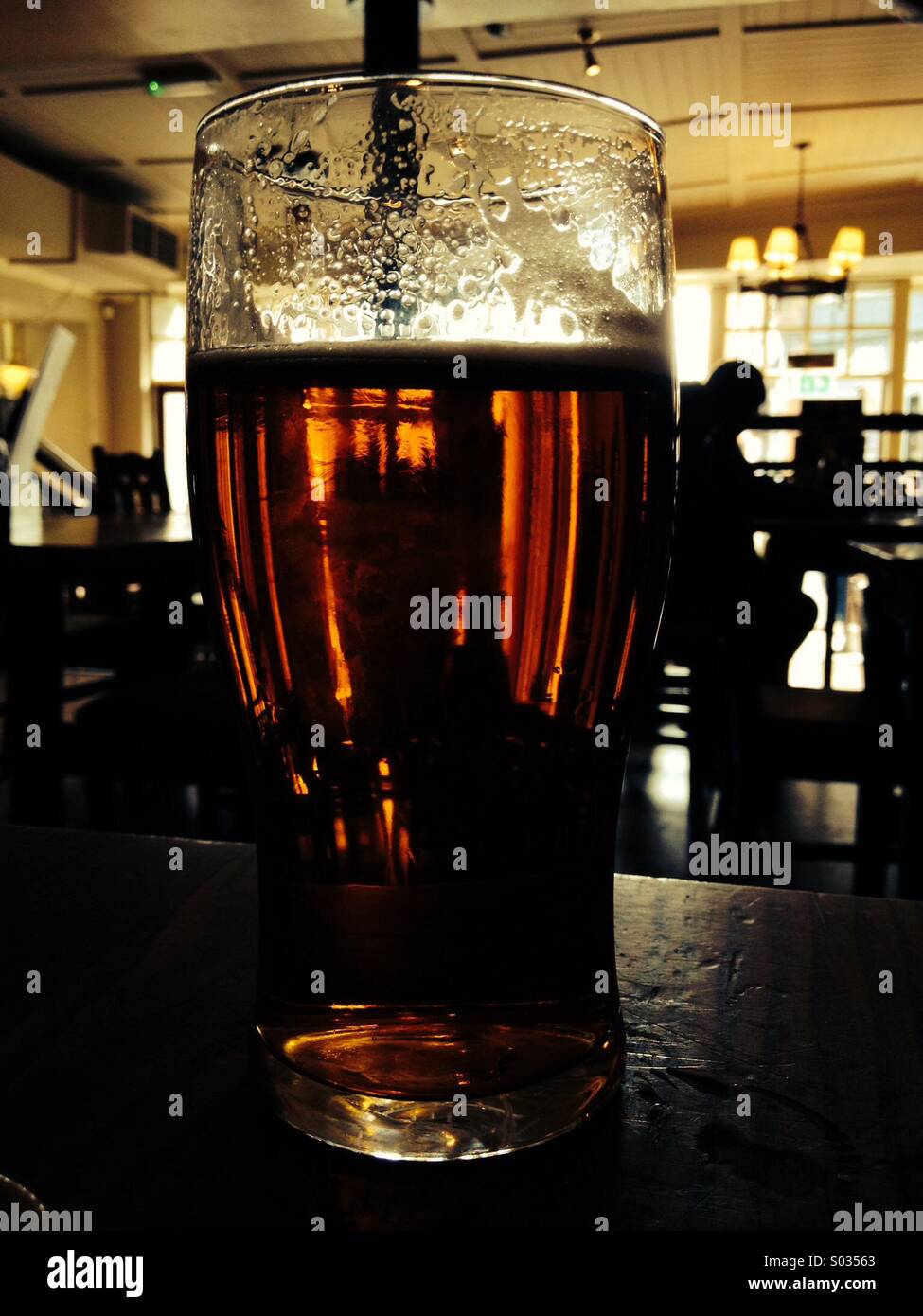 A cool pint of bitter in an English pub Stock Photo Alamy