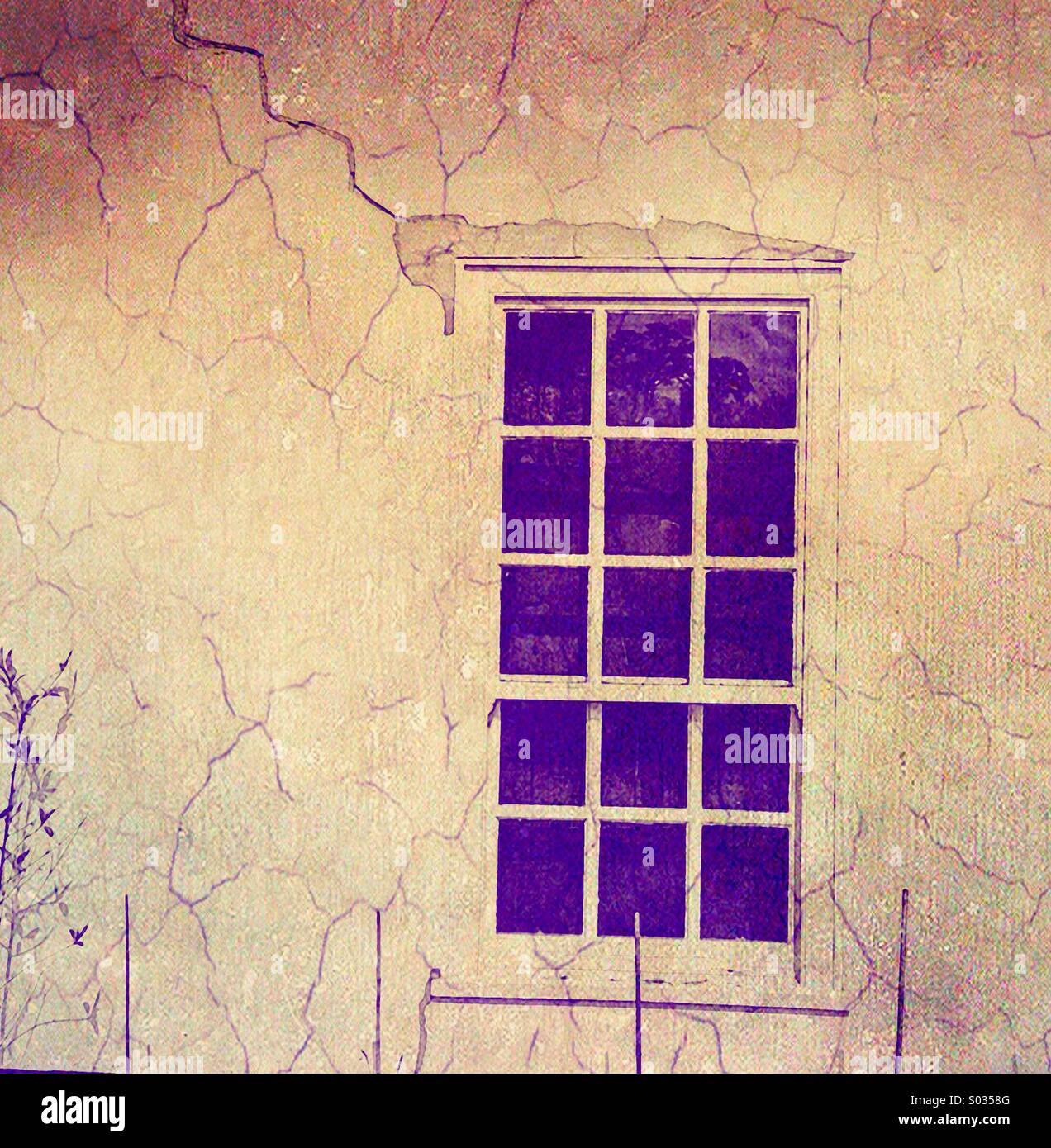 Sash window in a wall with a crack coloured and texture added. - Smartphone Captured Stock Image