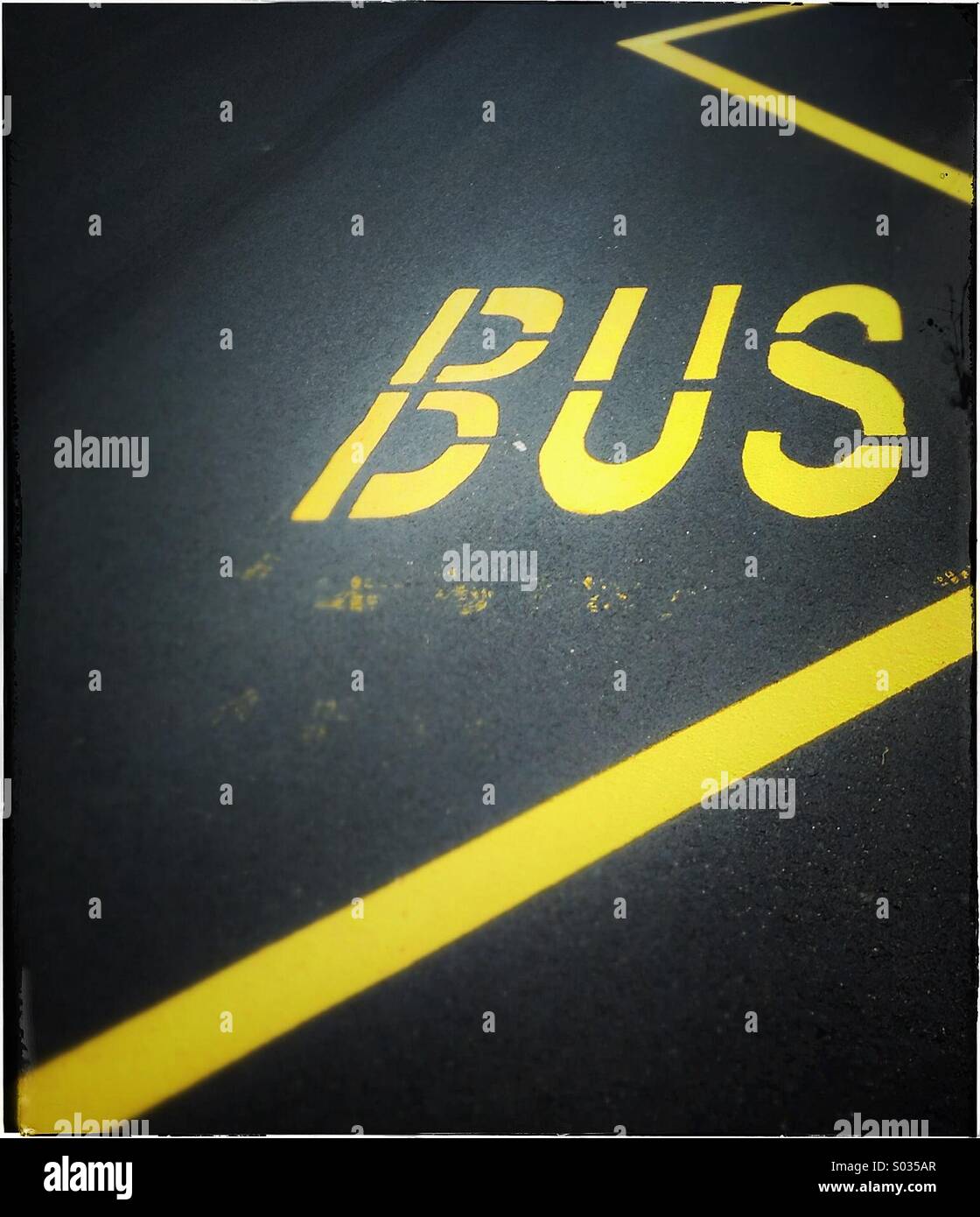 Bus stop sign painted on asphalt road in Barcelona, Catalonia, Spain Stock Photo