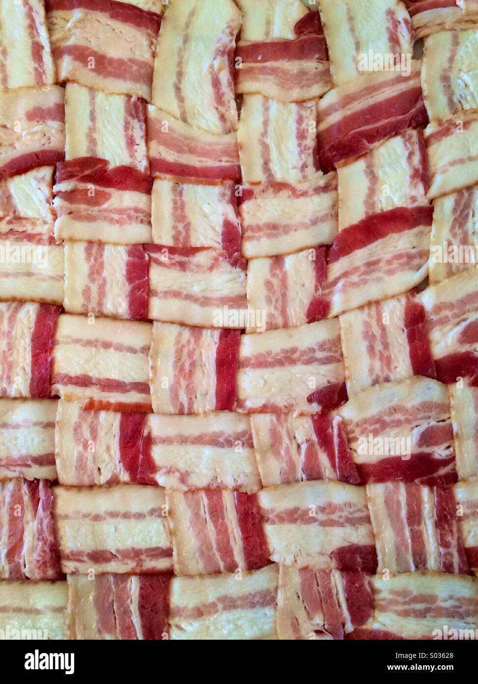 A woven bacon mat used for making a 'fatty' in a smoker. Stock Photo