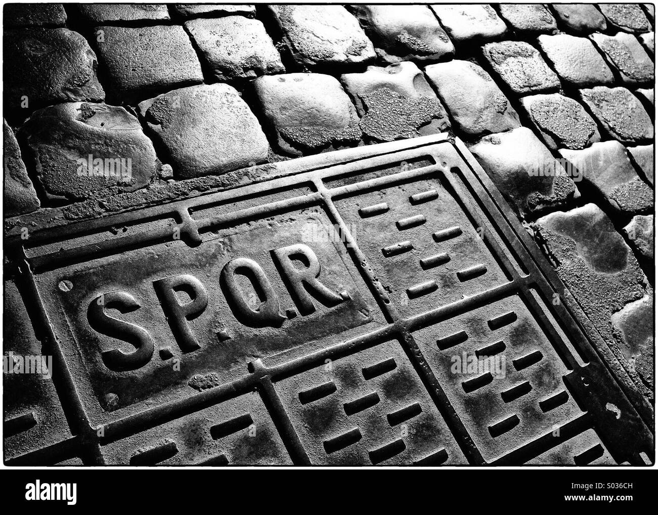 S.P.Q.R. On manhole cover, Rome, Italy Stock Photo
