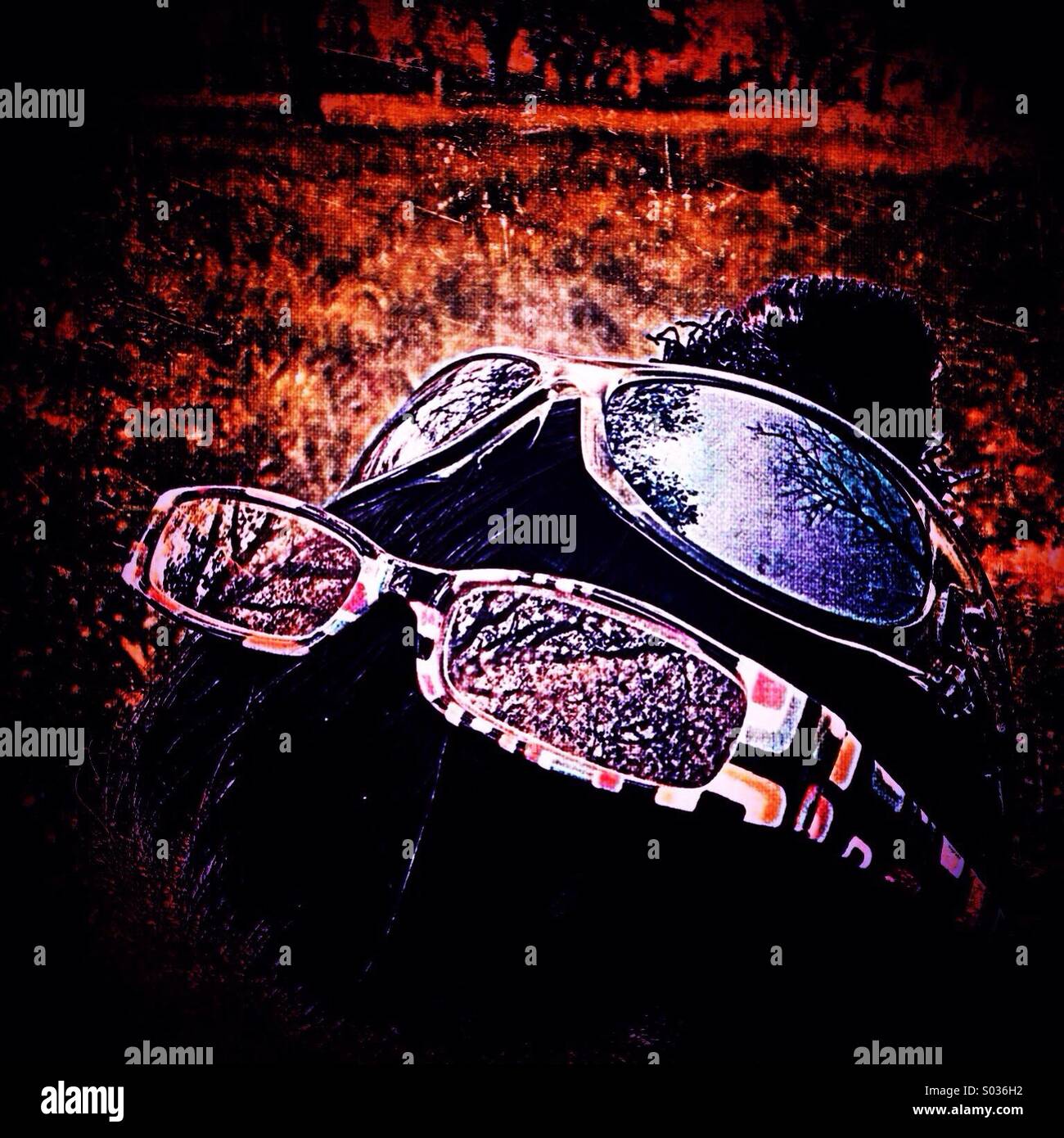 Reading glasses and sun glasses on woman's head - Smartphone Captured Stock Image