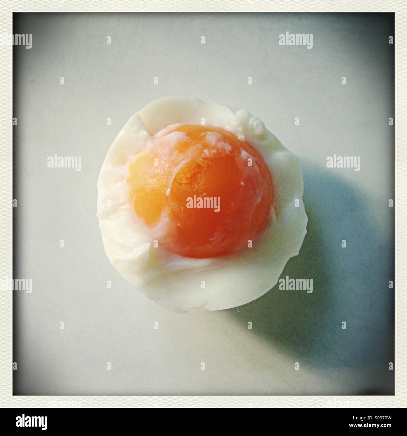 Peeled boiled egg with white partially removed. - Smartphone Captured Stock Image