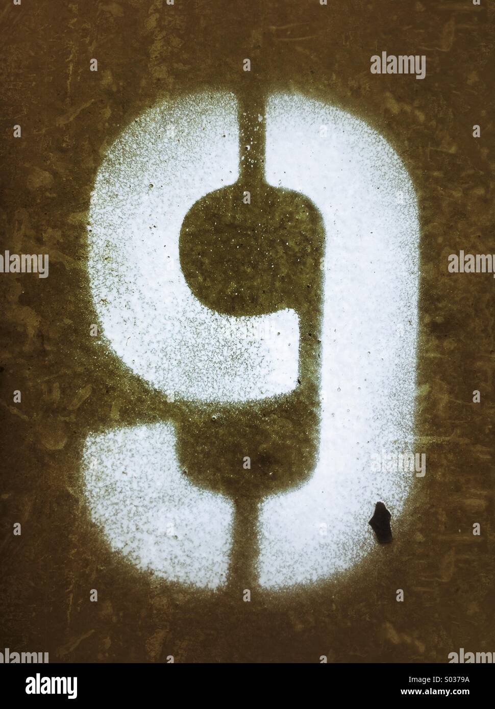 Number nine 9 spray painted in white using a stencil - Smartphone Captured Stock Image