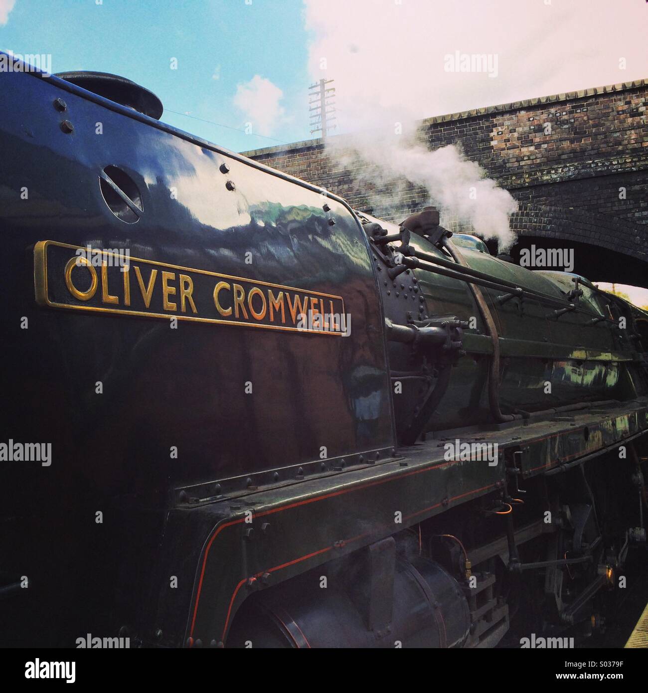 Great Central Railway 'Oliver Cromwell' named locomotive departing from a station. - Smartphone Captured Stock Image
