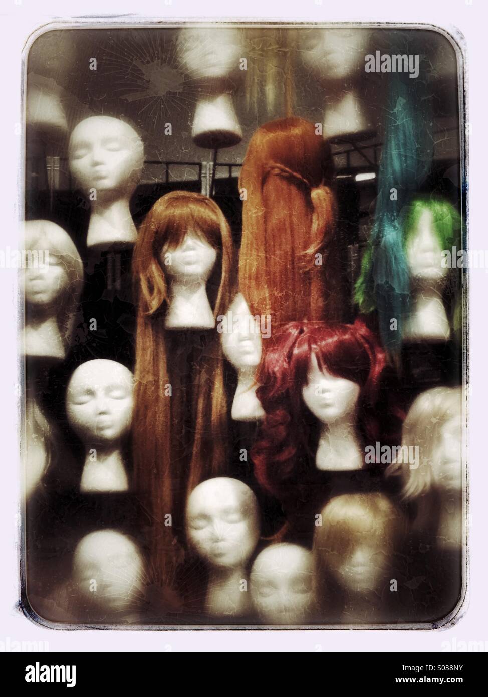 Group of mannequin heads, some with wigs, in display Stock Photo Alamy