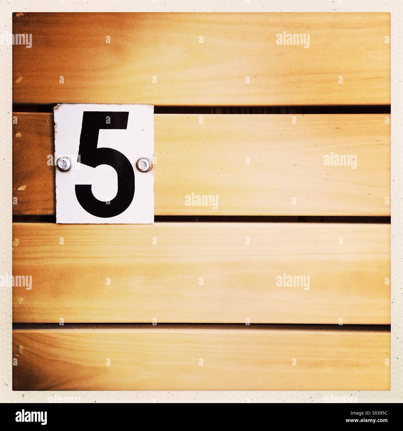 A vintage metal number five sign Stock Photo