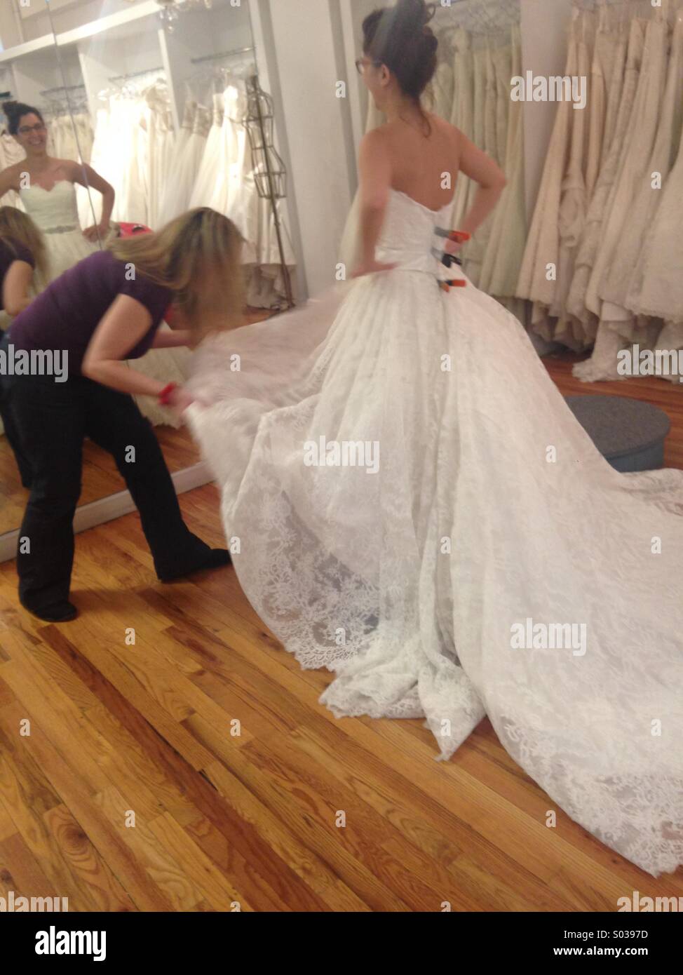 Wedding dress fitting Stock Photo Alamy