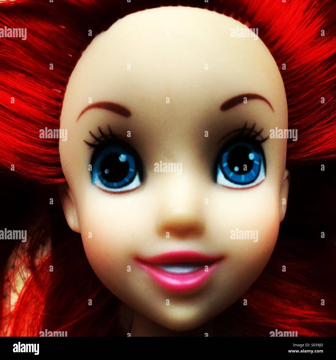 Close-up of a flame haired plastic toy doll. - Smartphone Captured Stock Image
