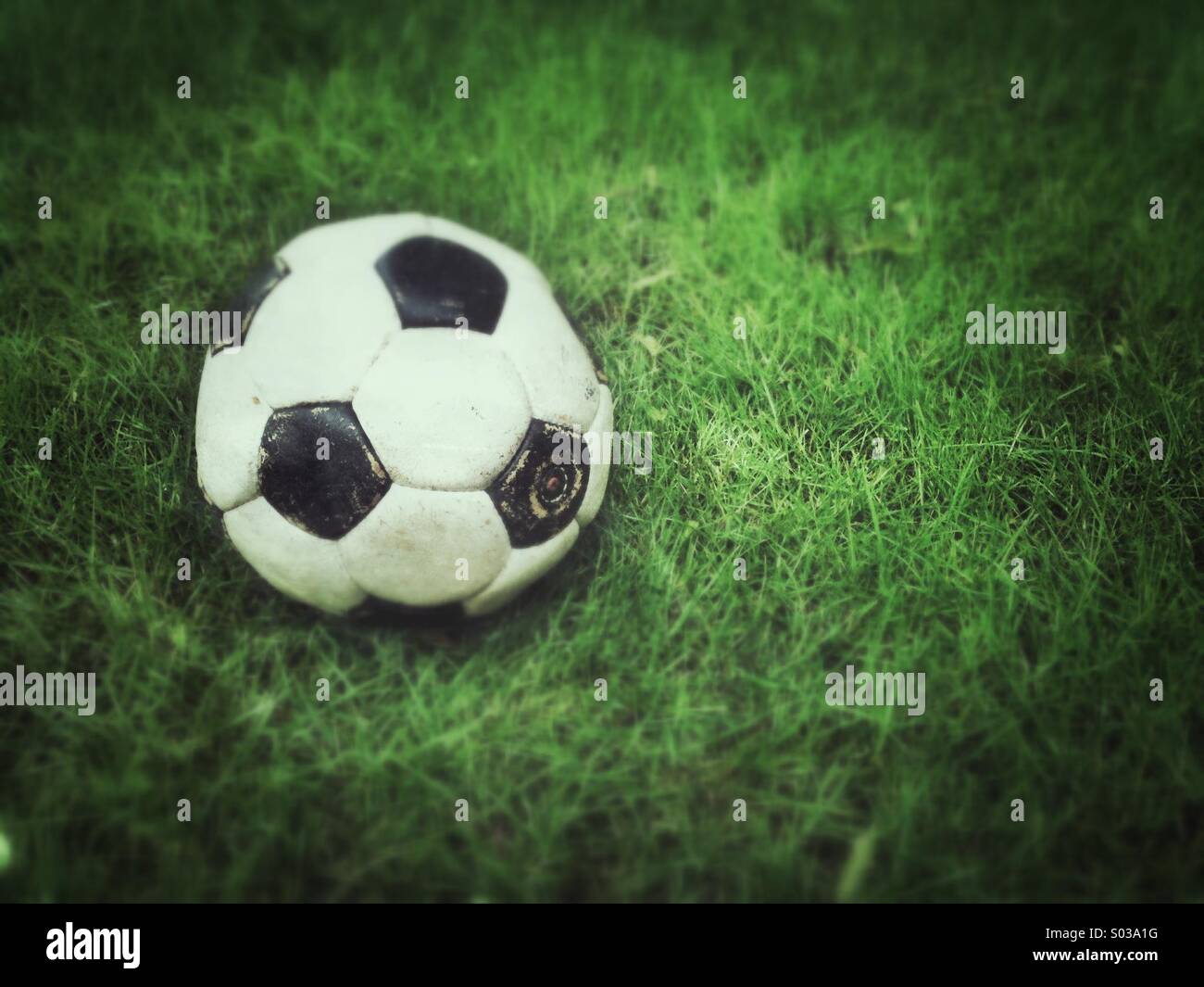 Old football with grunge effect applied. - Smartphone Captured Stock Image