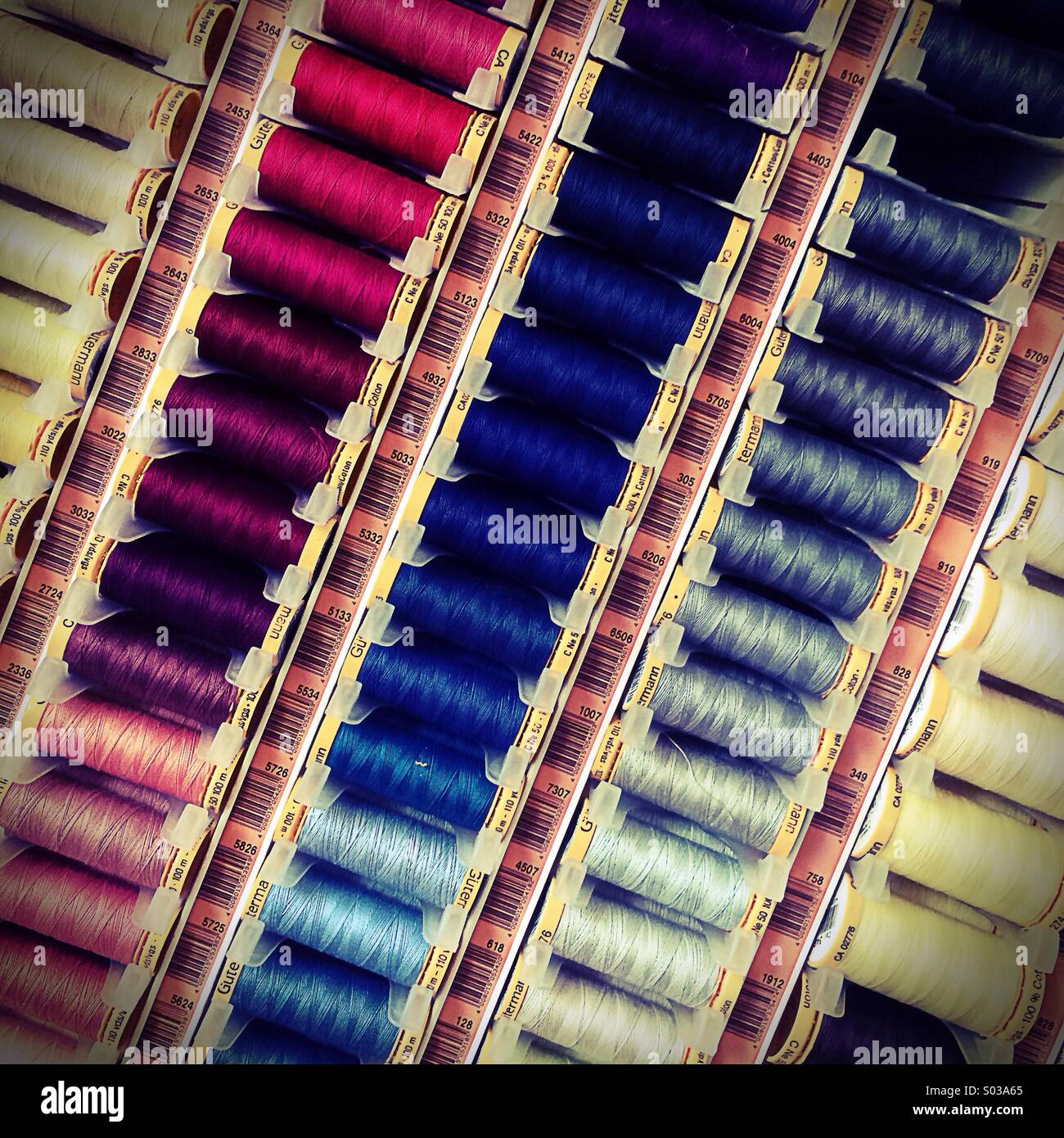 Colourful sewing thread for sale Stock Photo Alamy