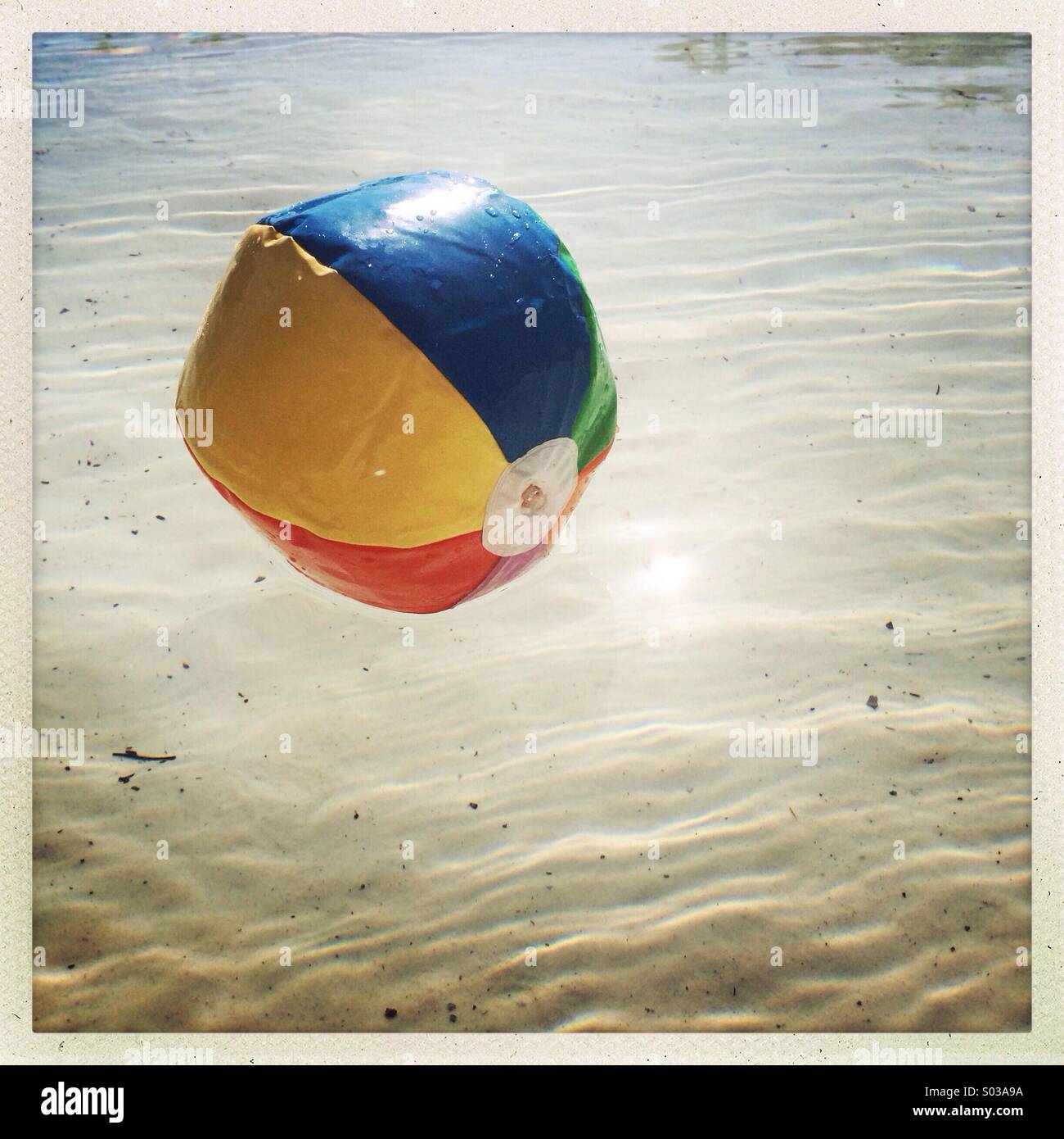 A beach ball floating on the water Stock Photo Alamy