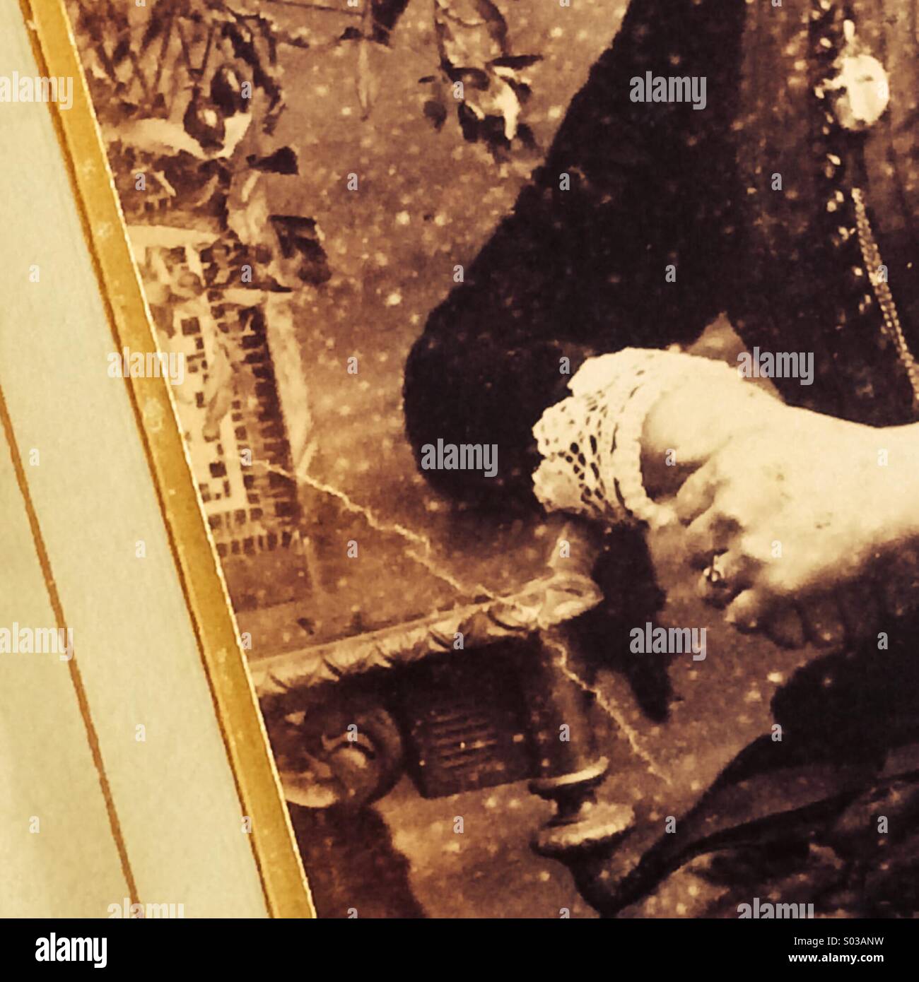 Hands of a Victorian lady posing in a now faded antique photograph - Smartphone Captured Stock Image