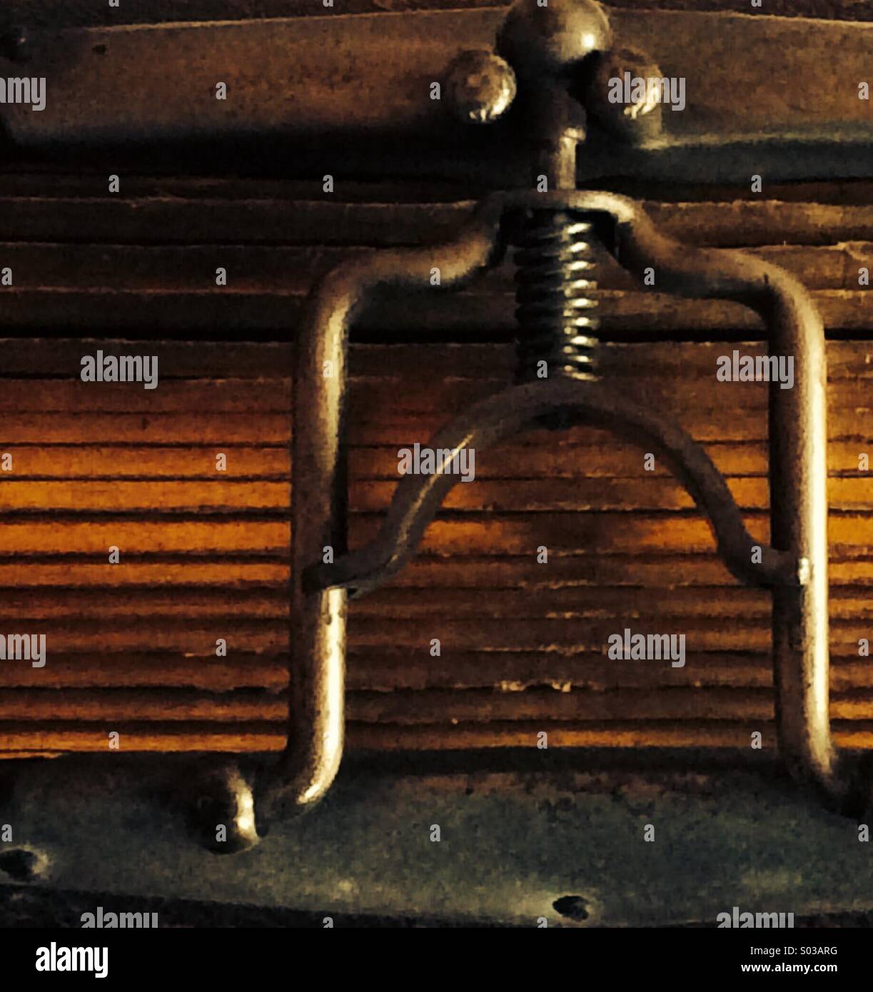 Metal clasp mechanism detail from an antique photograph album with gilded pages and leather cover - Smartphone Captured Stock Image