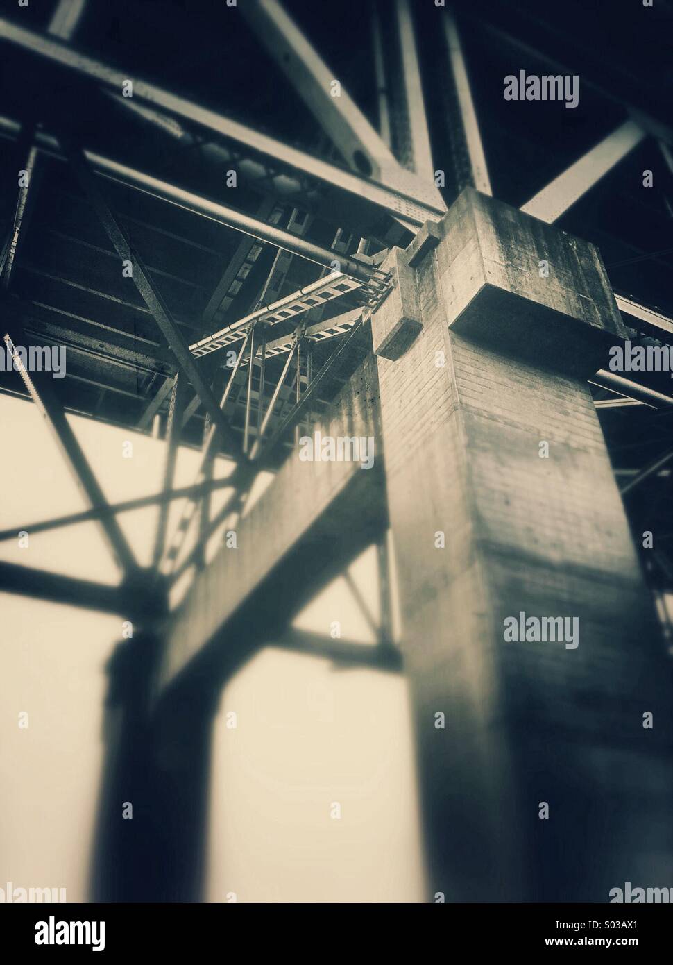 Steel girders and cement support pillar underneath the Granville Street Bridge, Vancouver, British Columbia, Canada. - Smartphone Captured Stock Image