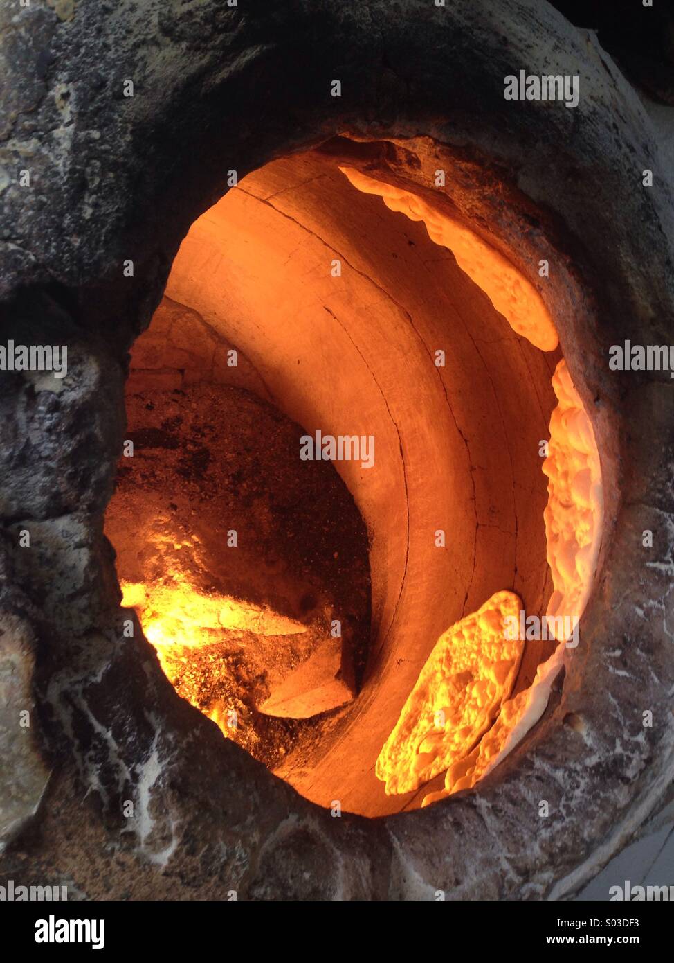 Clay oven cooking flat breads taken in Kuwait Stock Photo Alamy