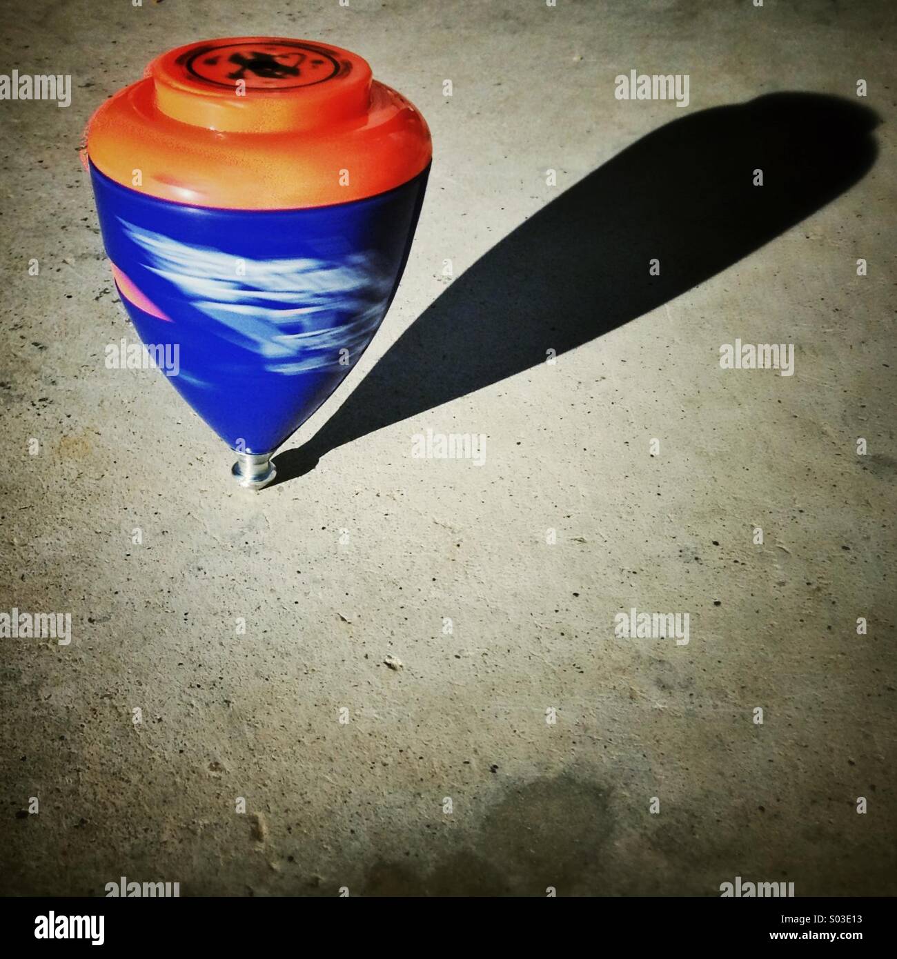 Colorful whirligig. Spinning top turning. - Smartphone Captured Stock Image