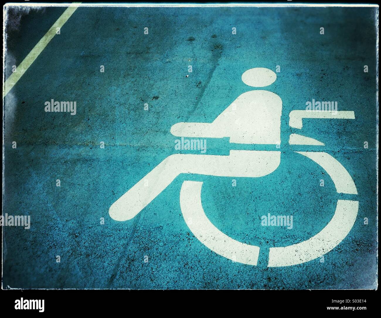 Handicapped disabled sign parking on road Stock Photo