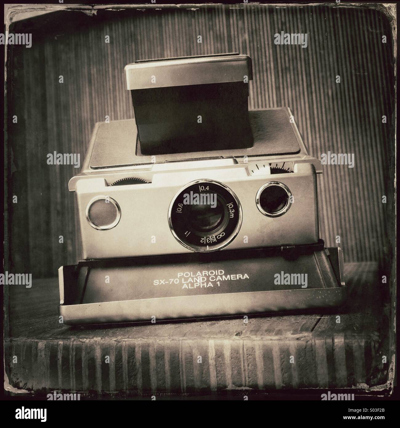 Old vintage instant camera Polaroid SX 70 - Smartphone Captured Stock Image